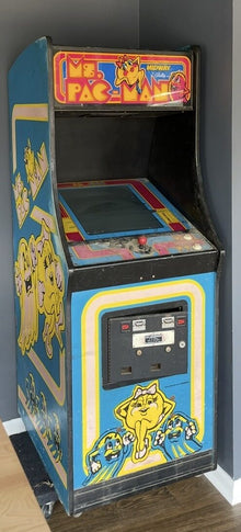 Ms. Pac-Man arcade cabinet standing in the shop