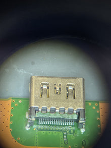HDMI connector on a circuit board seen under a microscope